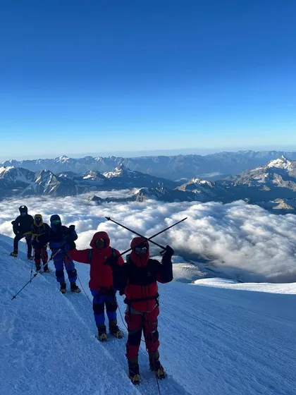 A moment of pure triumph on Mount Elbrus, the highest peak in Europe. Standing above a sea of clouds, our climbers soak in a view that few will ever witness. This is the reward for every hard step taken on the journey to one of the Seven Summits.