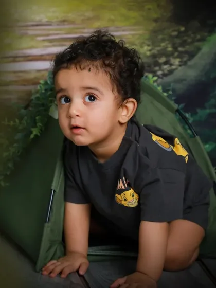 Peeking out from his tent, this little explorer is full of curiosity. The forest theme is perfect for capturing a sense of adventure.