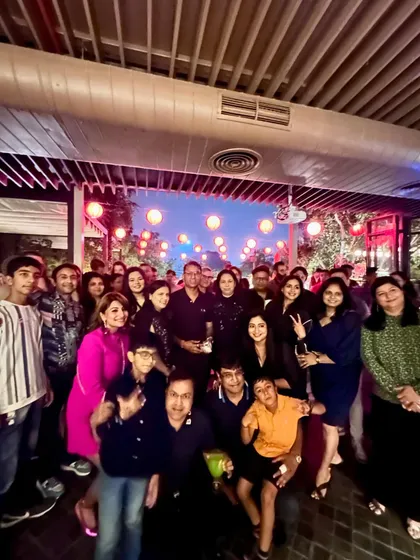 The whole gang, including family and friends, gathered for the birthday cocktail dinner.