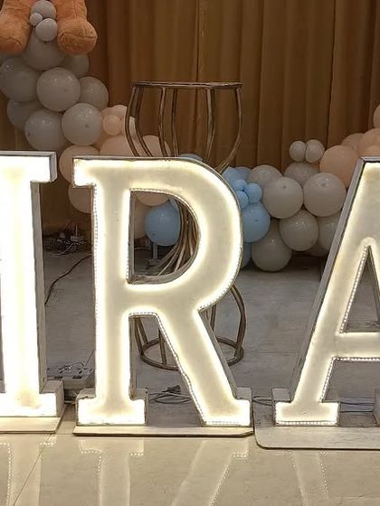 A close-up of the custom light-up marquee letters I provide, which can spell out any name to personalize your event.