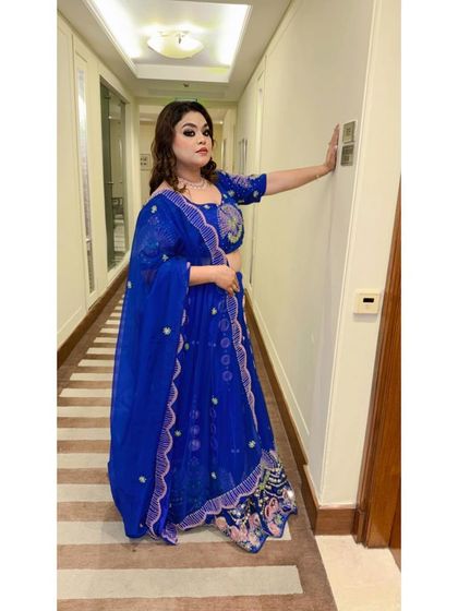 A stylish pose in a hotel corridor, showing off the full blue lehenga. My rental outfits are perfect for destination weddings and creating Instagram-worthy moments.