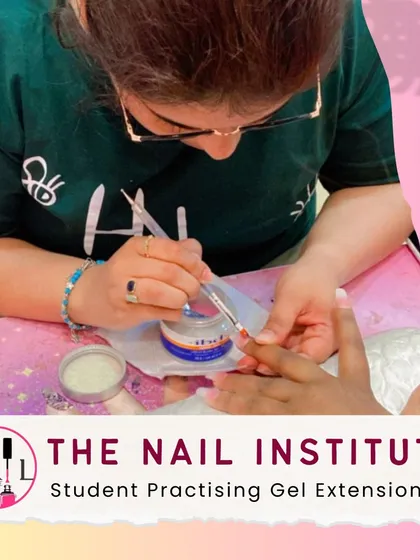 This student is practicing gel extension application, focusing on creating a smooth surface and a natural-looking arch.
