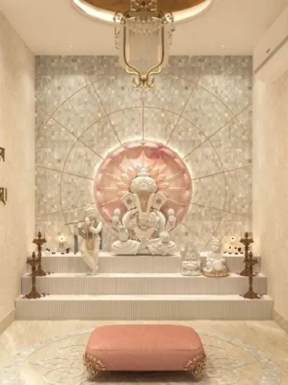 A tranquil pooja room featuring a multi-tiered platform for idols, set against a mother-of-pearl style lotus backdrop. The space is softened with warm lighting, and the walls include engraved Sanskrit shlokas for a complete spiritual experience.