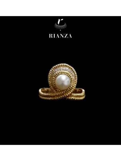 A unique gold ring with a central pearl, featuring intricate wire work. This piece was designed to capture the free-spirited and unconventional style of an Aquarius.