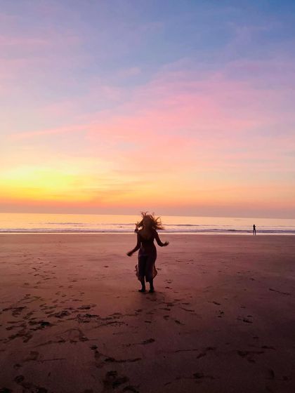 Dancing on the beach at sunset. This is a reminder to myself to embrace freedom, joy, and playfulness as an essential part of my spiritual practice.