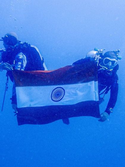Our divers celebrating Independence Day beneath the waves. These moments bring our community closer together, sharing a unique patriotic experience.