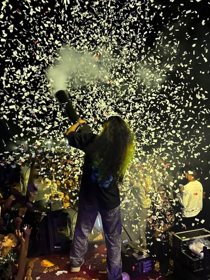 There is no better feeling than connecting with the crowd. Here I am, firing a confetti cannon over a massive audience, creating a moment of pure celebration and energy that defines my shows.