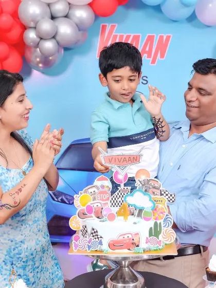 A thrilling 'Avengers' themed birthday party, with superhero cutouts, a cityscape backdrop, and dynamic balloon arrangements, ready for action.