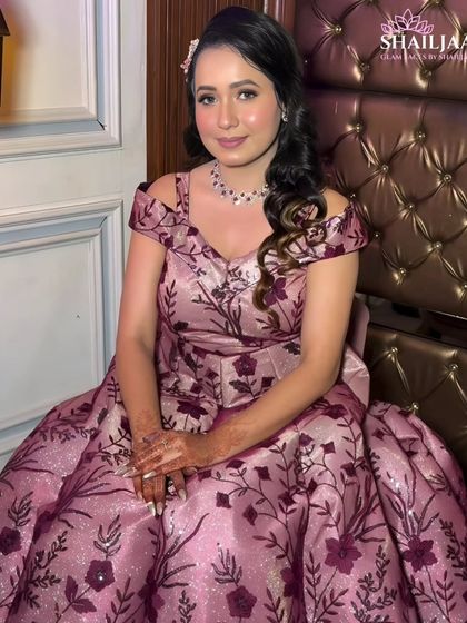 A full view of this client's beautiful floral engagement gown. The makeup is kept soft and romantic to match the dress.