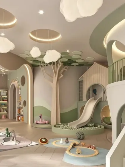 An alternate view of the playzone, showcasing the cloud-like light fixtures and the tree-inspired architectural elements that bring the outdoors inside.