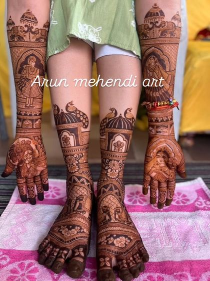 This complete bridal set features bride and groom portraits on the hands and beautiful peacock designs on the feet, all tied together with similar patterns.