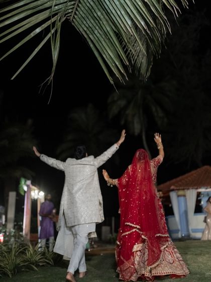 The bride and groom run off into the night after their ceremony, a spontaneous moment of freedom and joy. We are always ready for the unexpected.