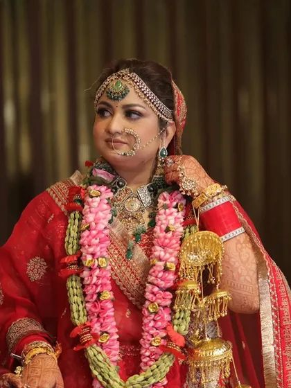 A moment during the wedding ceremony, with the bride looking serene and beautiful in her full bridal attire.