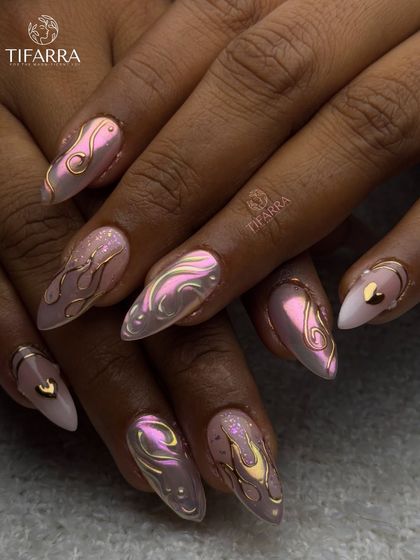 Another view of the fiery and graceful nail set, showing how the different designs with chrome, glitter, and gold hearts come together.