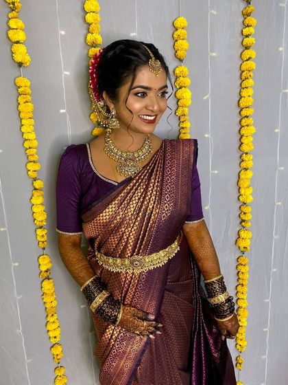 The same antique kemp set looks just as stunning with a deep purple saree. This shows how versatile a high quality jewellery set can be, adapting to different color palettes for various wedding events.