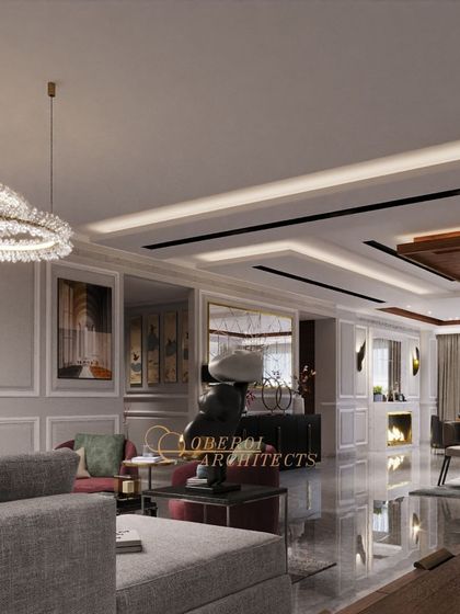 A family lounge designed for comfort and style, featuring a neutral color palette with rich burgundy accents. The fireplace adds a cozy focal point to the elegant space.