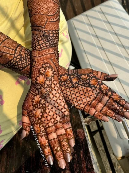 The beautiful dark stain of a full floral backhand design.
