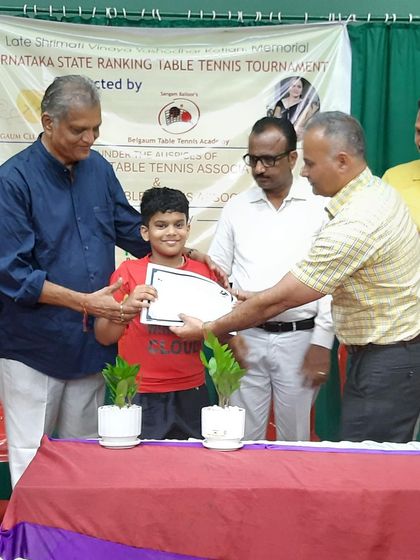 Sharvil K being awarded for his 3rd place finish in the Under 11 Boys category at the Belgaum state ranking tournament.