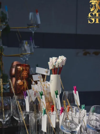 A collection of our custom glassware and stirrers, ready for the party. These small details contribute to a cohesive and well-thought-out bar design.