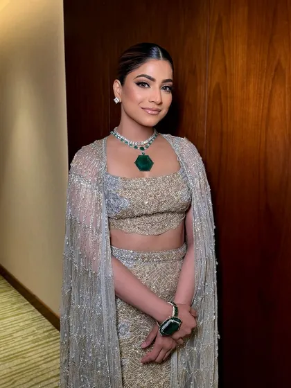 A beautiful portrait. Her smile and the elegant makeup create a look of effortless grace.