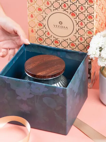 We take pride in our luxurious and festive packaging. This image shows the unboxing of our mercury glass jar candle, revealing the care and detail that goes into every gift we prepare.