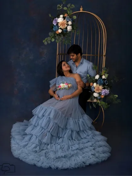 The loving gaze between this couple says it all. The elegant cage setup provides a perfect frame for their connection.