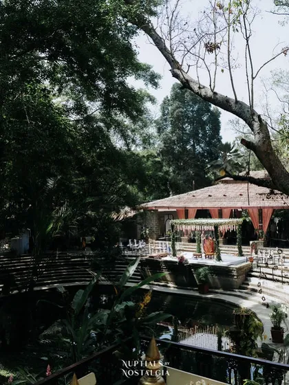 A wide shot of the Pond Pavilion decorated for a wedding, showing the full scale of a celebration by the water.