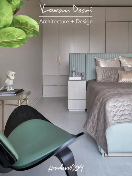 The master bedroom in Row House 904 is designed to be a serene, meditative space. The color palette is calm and soothing, with soft greens and beiges creating a connection to the surrounding nature.