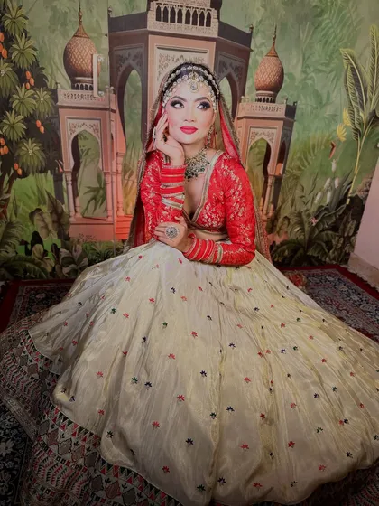 A full-length shot showing the grandeur of the bridal outfit. The makeup stands out beautifully, completing the entire look.