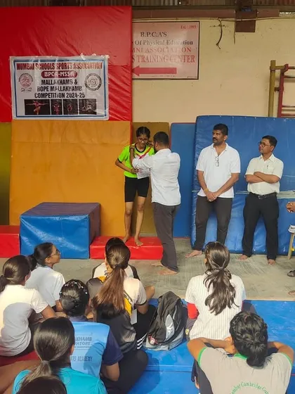 An official presents the award to Twarita during the MSSA competition ceremony. The formal setting of these events teaches our students sportsmanship and respect for the tradition of the sport.