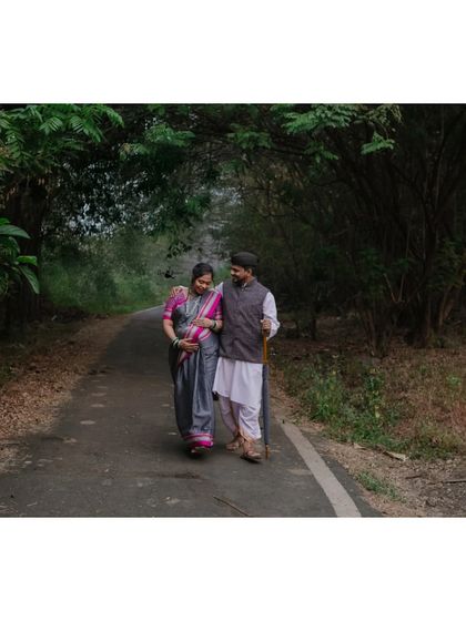 Walking hand in hand, surrounded by nature. This shot captures the feeling of a shared journey, both on the path and in life.