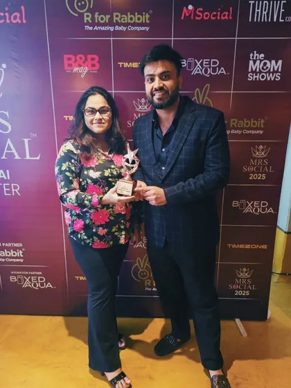 Receiving my award at the Mrs. Social event. A huge thank you to the organizers for this incredible recognition.