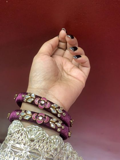 These purple velvet-finish bangles with floral kundan work are perfect as return gifts for weddings or parties. I accept bulk orders for such custom pieces.