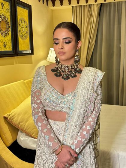A full view of Khushboo's royal look in her Manish Malhotra lehenga. The sleek hair and kohl-rimmed eyes are pure glamour.