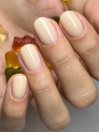 The perfect jelly nude manicure. This semi-sheer polish gives a clean, healthy, and incredibly chic finish to these natural oval nails.
