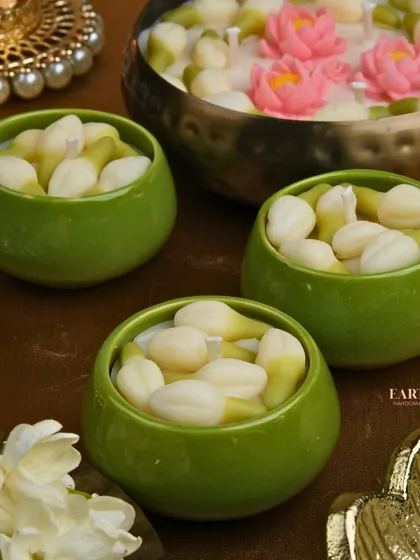 A set of three jasmine bud candles, creating a lovely and fragrant display.