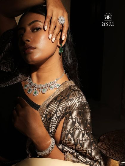A captivating shot of a model adorned in a full diamond and emerald set, showcasing the kind of statement pieces waiting to be discovered at my Worli store.