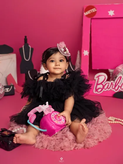 Come on Barbie, let's go party! This little fashionista is living her best life in a Barbie-themed world, complete with a pink phone and all the glamorous accessories.