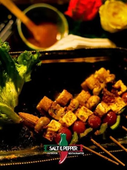 A platter of assorted vegetarian kebabs, including paneer, mushroom, and vegetable skewers. This offers a delicious variety for guests who prefer vegetarian options.