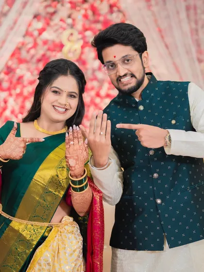 The moment it becomes official. Shraddha and Vivek playfully show off their new engagement rings, a fun and celebratory shot that captures the excitement of the day.