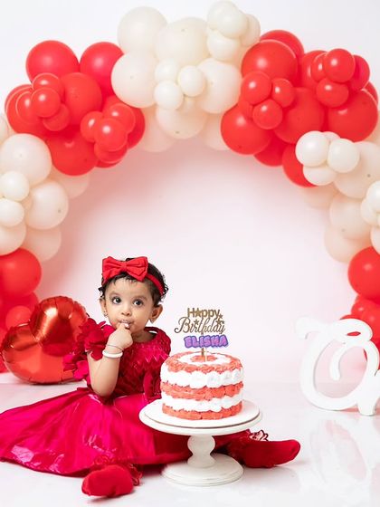 A thoughtful, curious look before she goes all in. Cake smash sessions are full of a wide range of adorable expressions.
