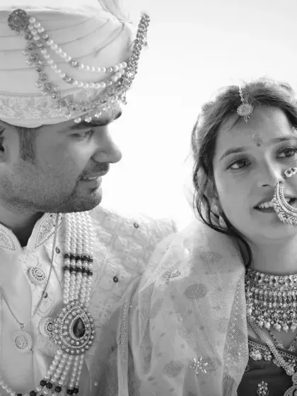 A timeless black and white portrait of the couple from their Triyuginarayan wedding, capturing a raw and intimate moment.