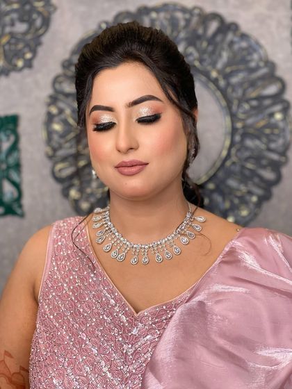 Another angle of Divisha's makeup, with her eyes closed to showcase the beautiful champagne glitter on her lids.