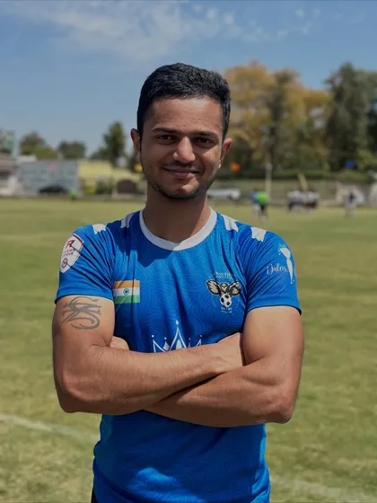 Smiling faces on the field. A portrait of one of our players, capturing the passion and love for the game that unites us all.