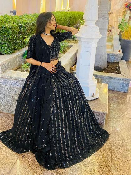 A relaxed and stylish pose in the black sequin lehenga. It’s comfortable enough to wear all night while still looking incredibly chic.
