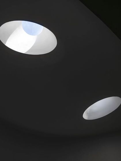 A detail of the skylights at the Vismaya museum. The abstract, sculptural quality of the openings on the roof contrasts with the soft, diffuse light they create in the galleries below.