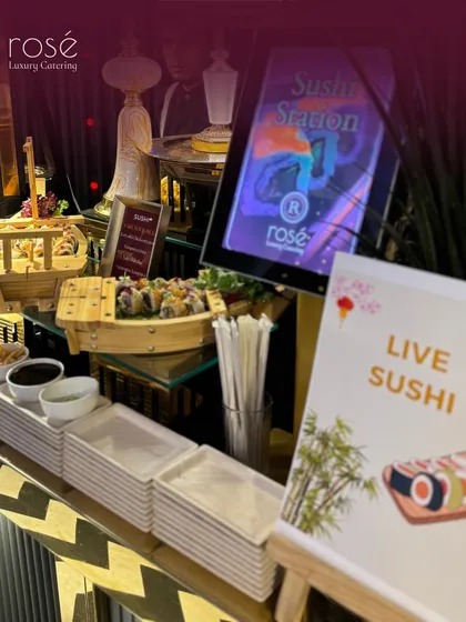 Another view of our live sushi station, highlighting the organized setup with fresh ingredients and clean plating. We make indulgence delicious and visually appealing.