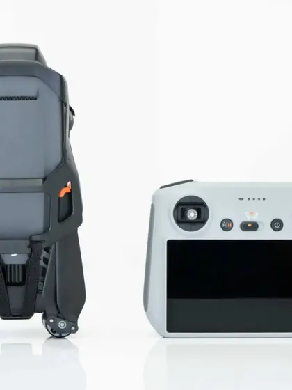 Our DJI Mavic 3 drone folded for transport, shown alongside its smart controller, representing our readiness for any project.