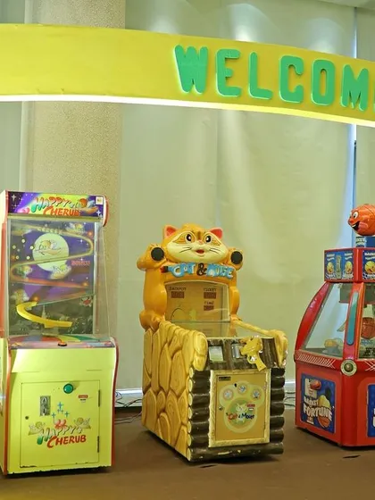 The entrance to Gecko's Garage featured a 'Welcome' arch and several real arcade games, instantly creating a fun and interactive atmosphere for the kids.