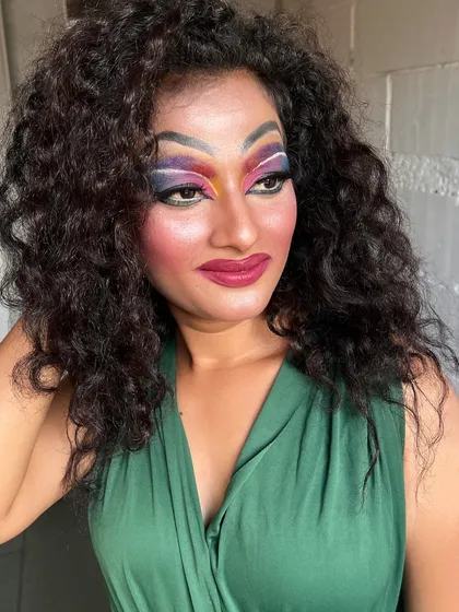 A powerful and vibrant drag queen makeup look created by one of our students. This demonstrates the creative freedom and technical skill that we encourage in our advanced makeup artistry courses.